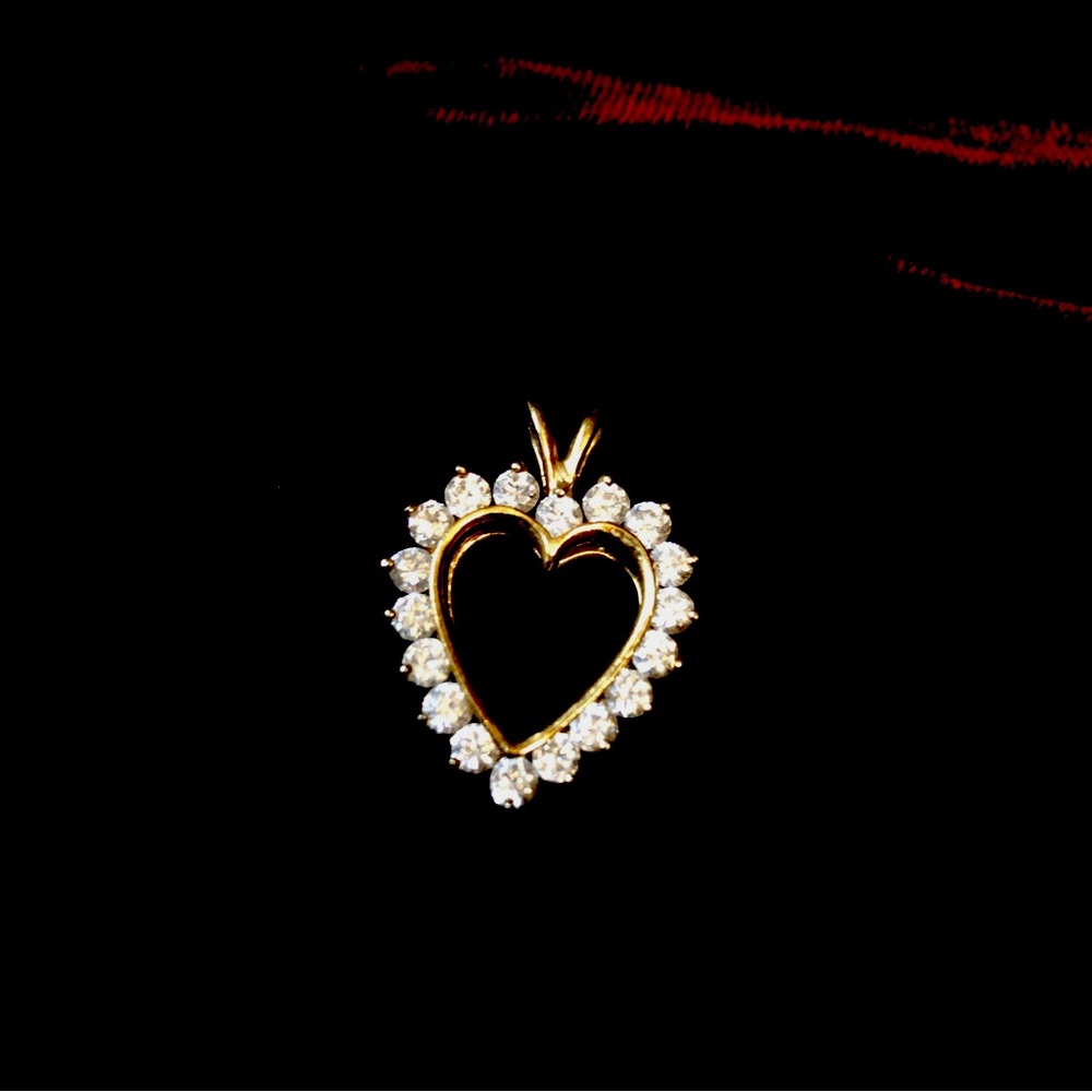 Small heart with white zircon stones. Pendent